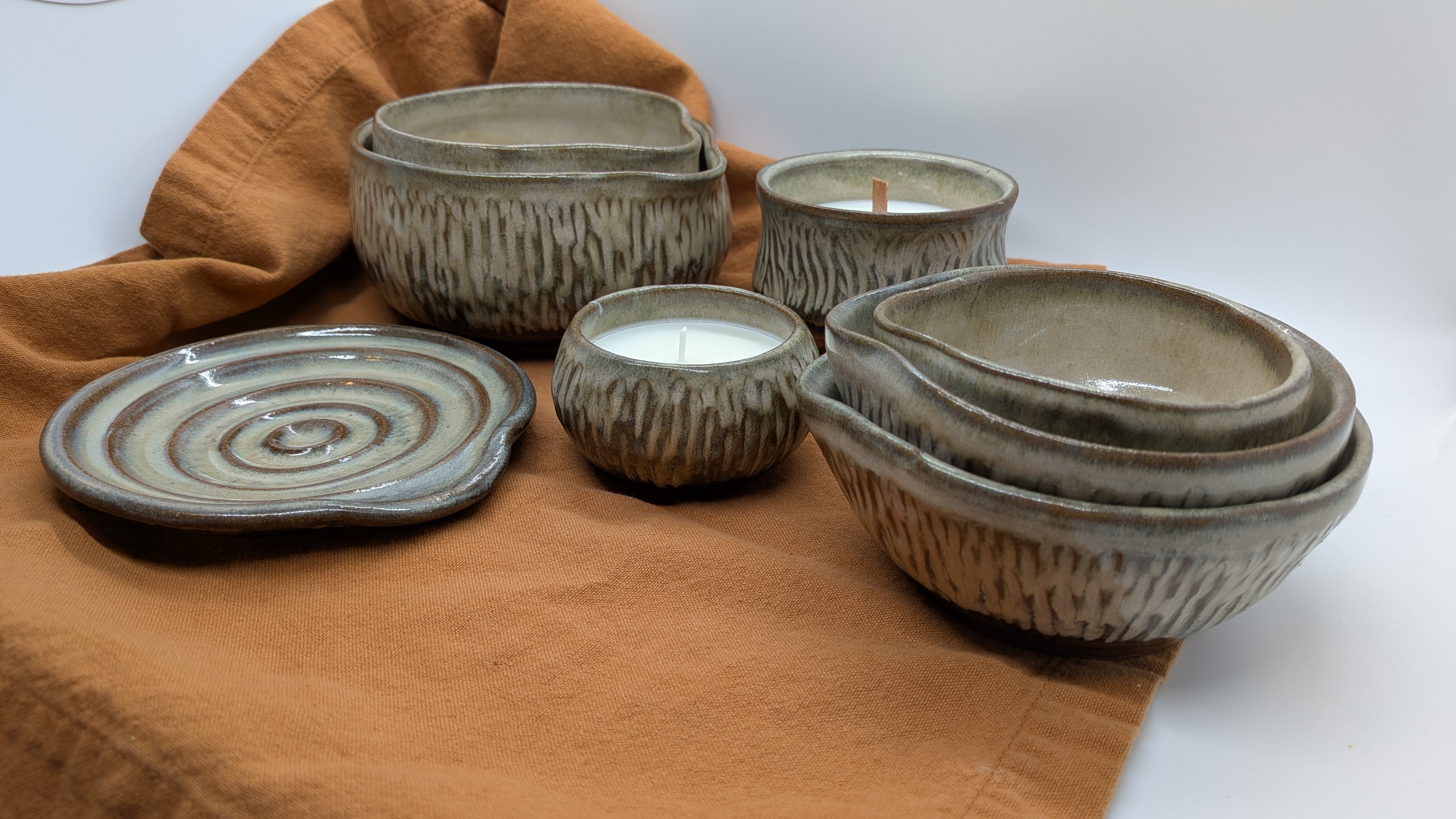 Kitchen Bundle - Cool Sepia - Get a full bundle of kitchenware items from the Cool Sepia color palette, including:

Set of 3 Nesting Mini Prep Bowls
Set of 2 Mini Mixers
1 Spoon Rest
1 Salt Cellar / Mini Candle
1 Juice Cup Candle

Total value: $132

Purchase them all together for $125, mention that you saw them on my website, and I'll throw in your choice of any in-stock <a href=https://dragonflydenarts.com/category/sugar-and-spice-scoops>Sugar and Spice Scoop</a>, FREE.


 - 125
